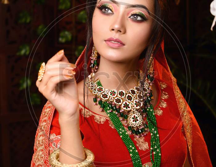 Magnificent Young Indian Bride in Luxurious Bridal Costume with