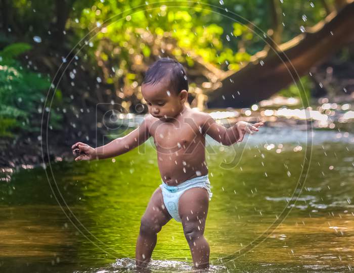 Funny baby best sale playing with water