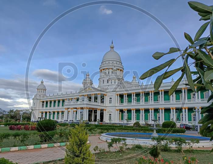 A Dramatic view of the Magnificent Lalitha Mahal Summer Palace in white color against the blue sky and the landscape at Mysuru,India.