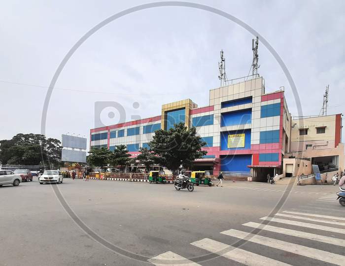 Beautiful view of Banashankari BMTC Bus Stand Building and Metro Station. One Side Vehicles are moving in the Circle.