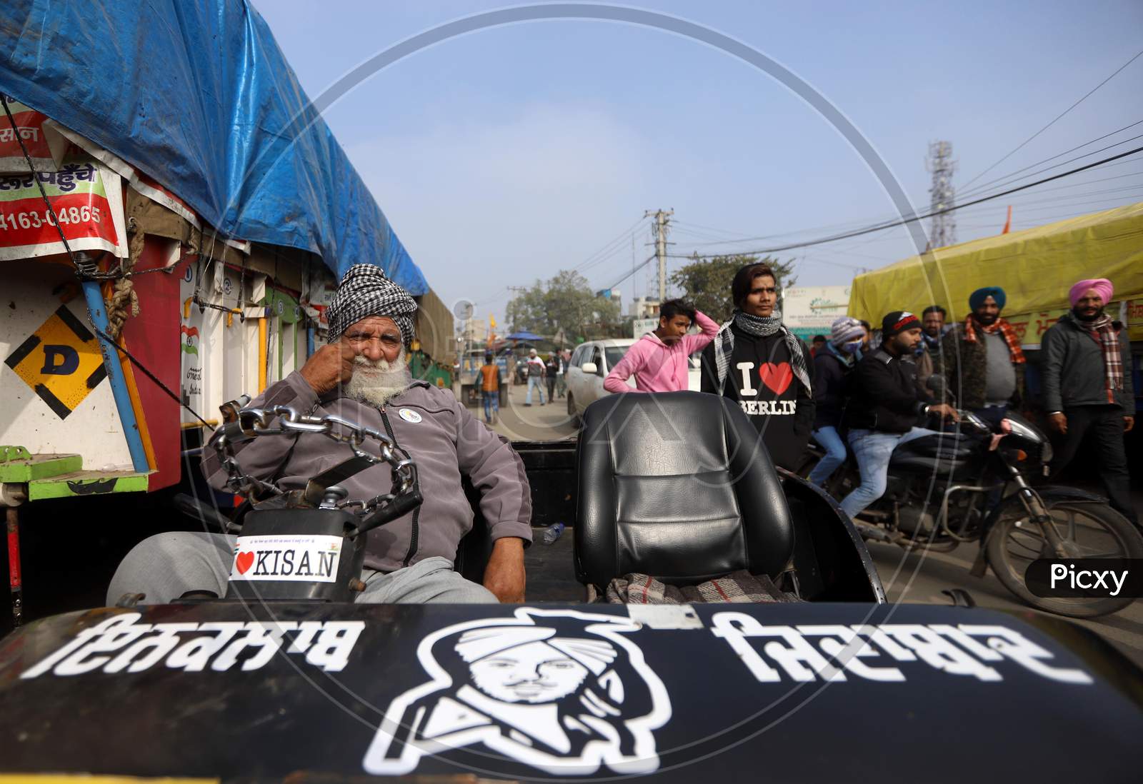 Farmers Sit On A Blocked National Highway At  Singhu Border Near New Delhi, On January 10, 2021, During An Ongoing Sit-In Protest Demanding The Rollback Of 3 Government Agricultural Reforms Bill. More Than 60 Protesters Have Died Since The Agitation Began In November-End, Farmer Groups Claim.