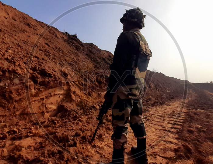 Security officers standing near the mouth of a 150-meter underground tunnel, constructed by Pakistan beneath International border, detected by BSF in Hiranagar sector of Kathua district in Jammu and Kashmir on Wednesday. The detection of the tunnel thwarted Pakistan's design to push terrorists into