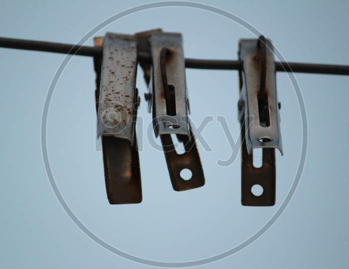 Group Of Color And Stainless Steel Clips Hang On The Rope Without Clothes