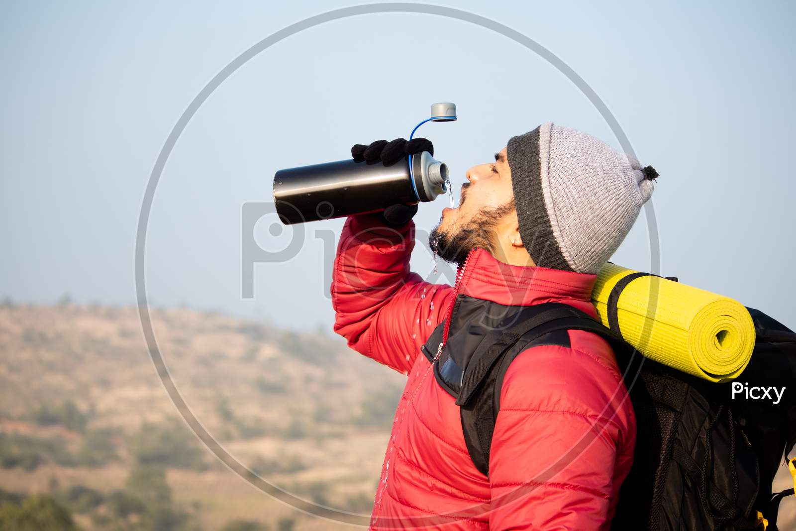 Thirsty Travler Drinking Water By Taking Break While Climbing - Concept Of Drink Water Before Feeling Thirsty.
