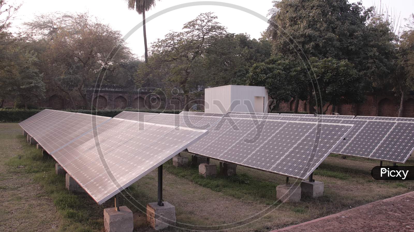 Solar panel located on thr green to get the amount of sunlight converted into electrical energy on sunny day, Solar photovoltaic panels and solar photovoltaic power generation systems