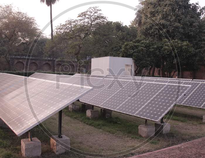 Solar panel located on thr green to get the amount of sunlight converted into electrical energy on sunny day, Solar photovoltaic panels and solar photovoltaic power generation systems