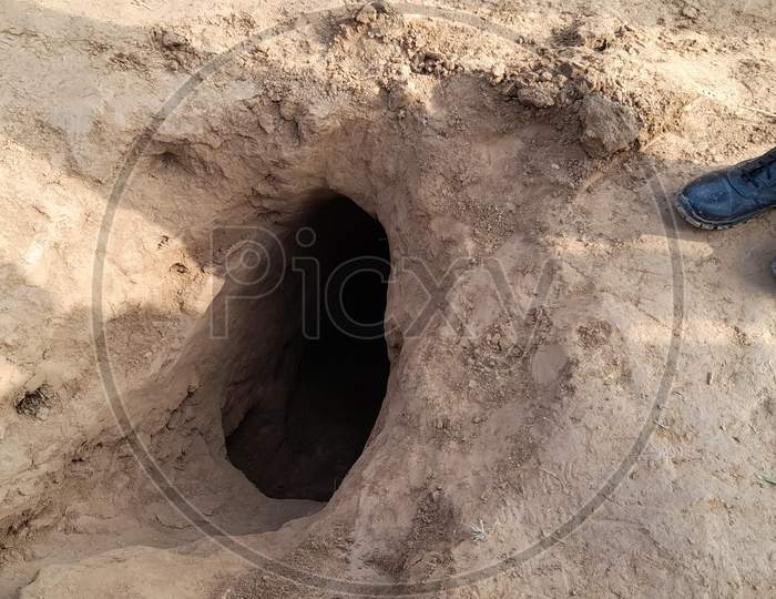 Security officers standing near the mouth of a 150-meter underground tunnel, constructed by Pakistan beneath International border, detected by BSF in Hiranagar sector of Kathua district in Jammu and Kashmir on Wednesday. The detection of the tunnel thwarted Pakistan's design to push terrorists into