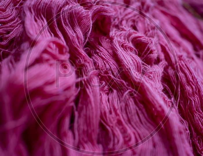 Close View Of The Pink Color Thread Yarns Used In Textile Industry