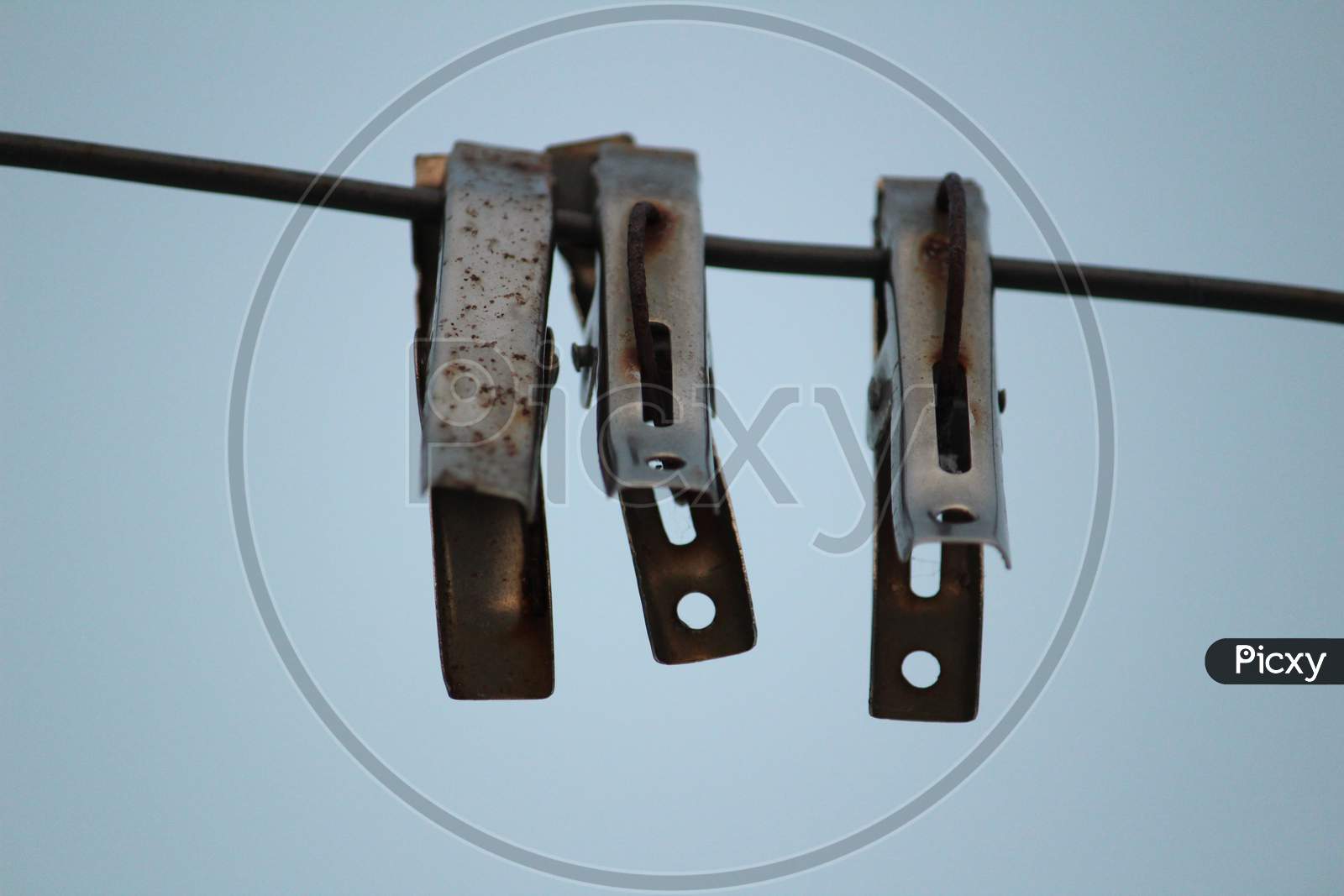 Image of Group Of Color And Stainless Steel Clips Hang On The Rope Without  Clothes-SJ196114-Picxy