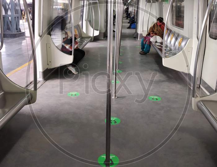 corona covid-19 social distancing singn in Delhi metro station Rajiv chowk