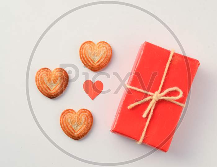 Valentines Day background with Red hearts,ribbon, message card,gift box and Heart-shaped cookies isolated on white background