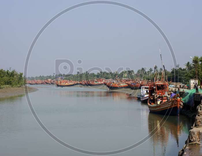 Some Fishing Boats Floating At Jetty Preparing To Go At Sea For Fishing.