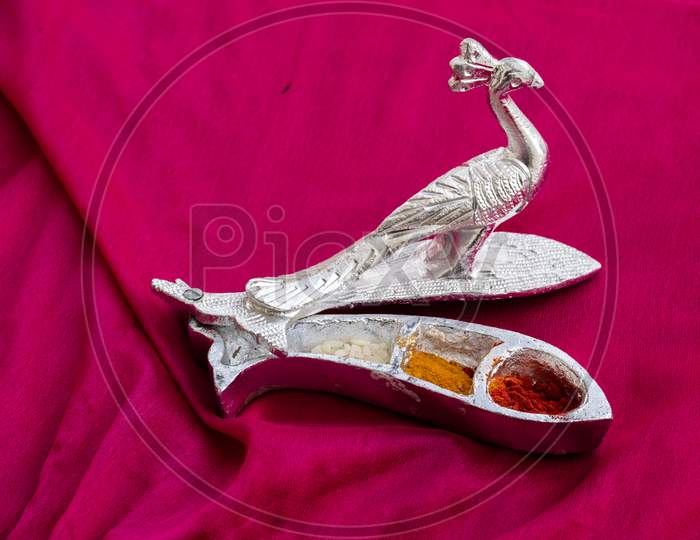 Beautifully Design And Carved Silver Peacock Statue , On Blur Background.
