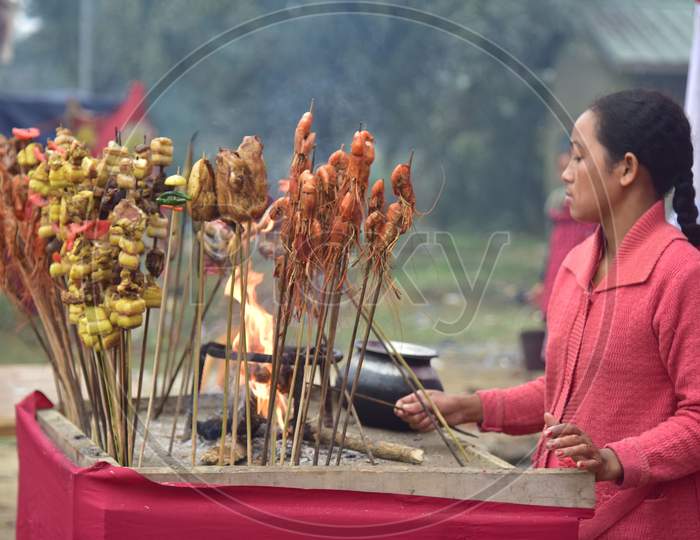 Traditional Assamese food is being prepared for  sale  on the occasion of the Magh Bihu festival celebration in Nagaon District of Assam on Jan 14,2021