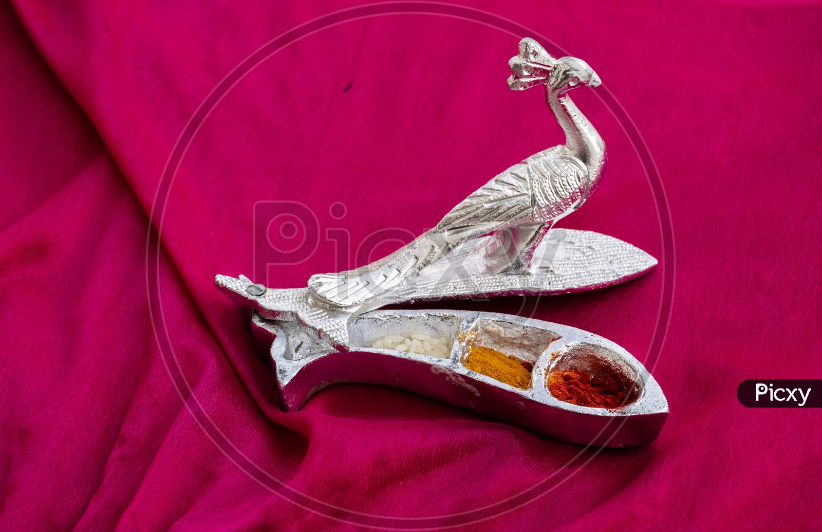 Beautifully Design And Carved Silver Peacock Statue , On Blur Background.