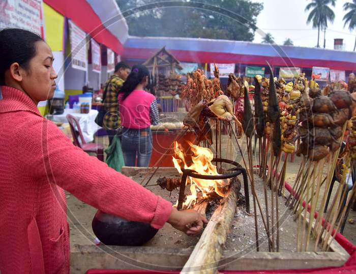 Traditional Assamese food is being prepared for  sale  on the occasion of the Magh Bihu festival celebration in Nagaon District of Assan on Jan 14,2021