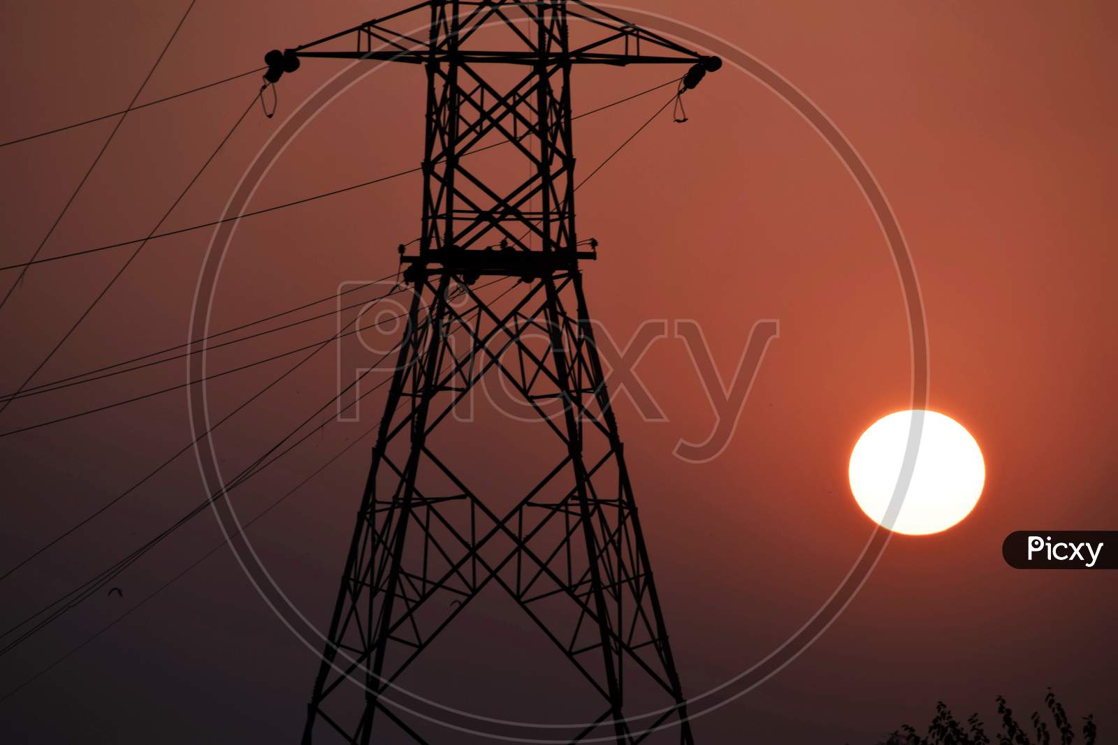 Beautiful Picture Of Electricity Tower And Sunset In Background