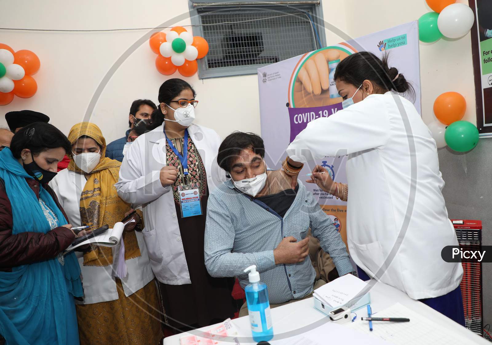 An Indian Doctor Receives A Covid-19 Vaccine At A Government Hospital In Jammu,Jan.16, 2021.
