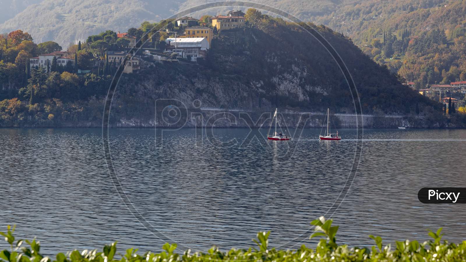 Lecco, Italy/Europe - October 29 : View Of Boats On Lake Como At Lecco On The Southern Shore Of Lake Como In Italy On October 29, 2010. Four Unidentified People