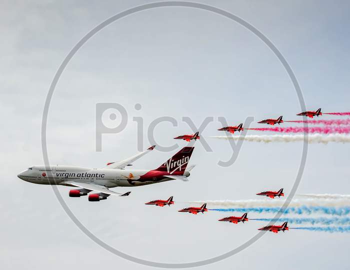 Virgin Atlantic Boeing 747-400 And Red Arrows Aerial Display At