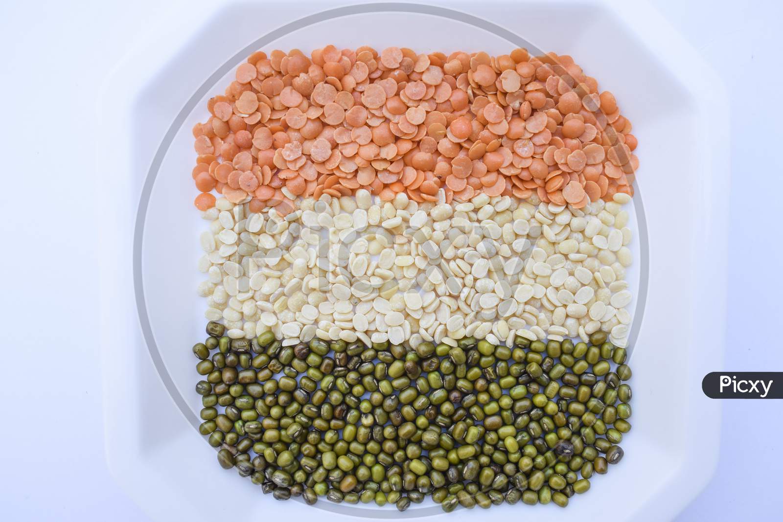 Happy Republic Day, Indian Republic Day Themed Tricolor Indian Flag Colors Saffron, White And Green. Indian Flag Themed Food, Indian Cuisine Dals, Pulses Lentils Arranged
