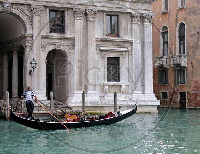 Venice, Italy - October 26 : Gondolier Rowing Along A Canal In Venice On October 26, 2006. Unidentified Man.