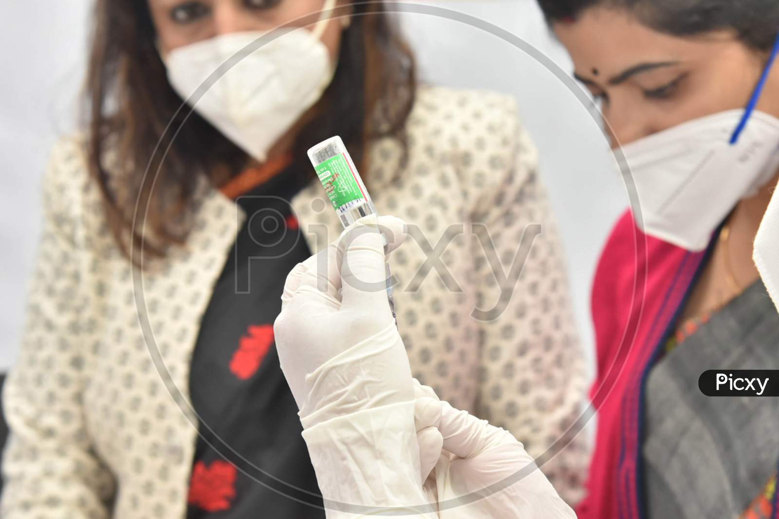 A medic shows a Covishield vaccine dose, after the virtual launch of COVID-19 vaccination drive by Prime Minister Narendra Modi, at GMCH hospital in Guwahati on Jan 16,2021