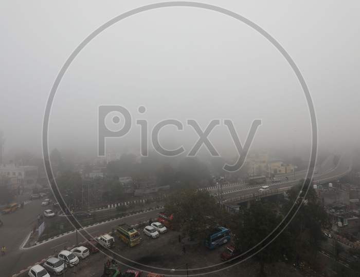 Vehicles Ply On A Road Amid Heavy Fog In Jammu,16,Jan,2021.