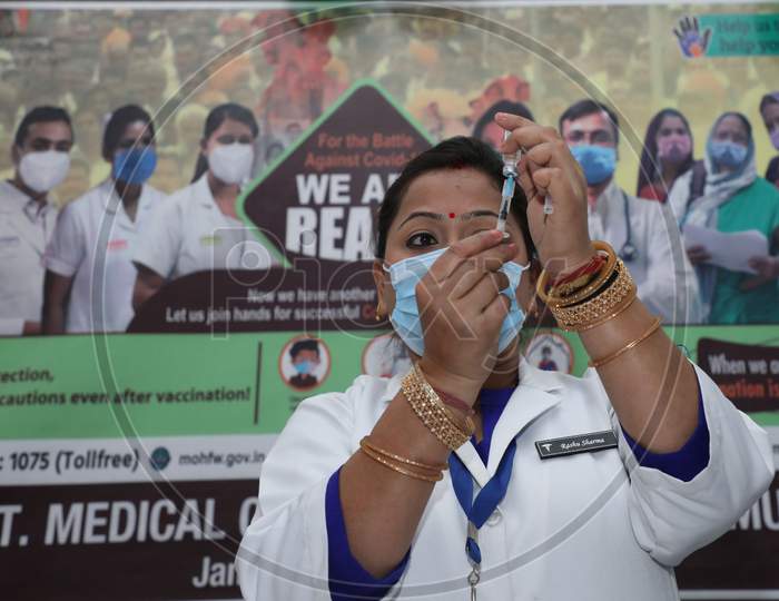 A Health Worker Prepares To Administer Covid-19 Vaccine To A Doctor At A Government Hospital In Jammu,Jan.16, 2021.