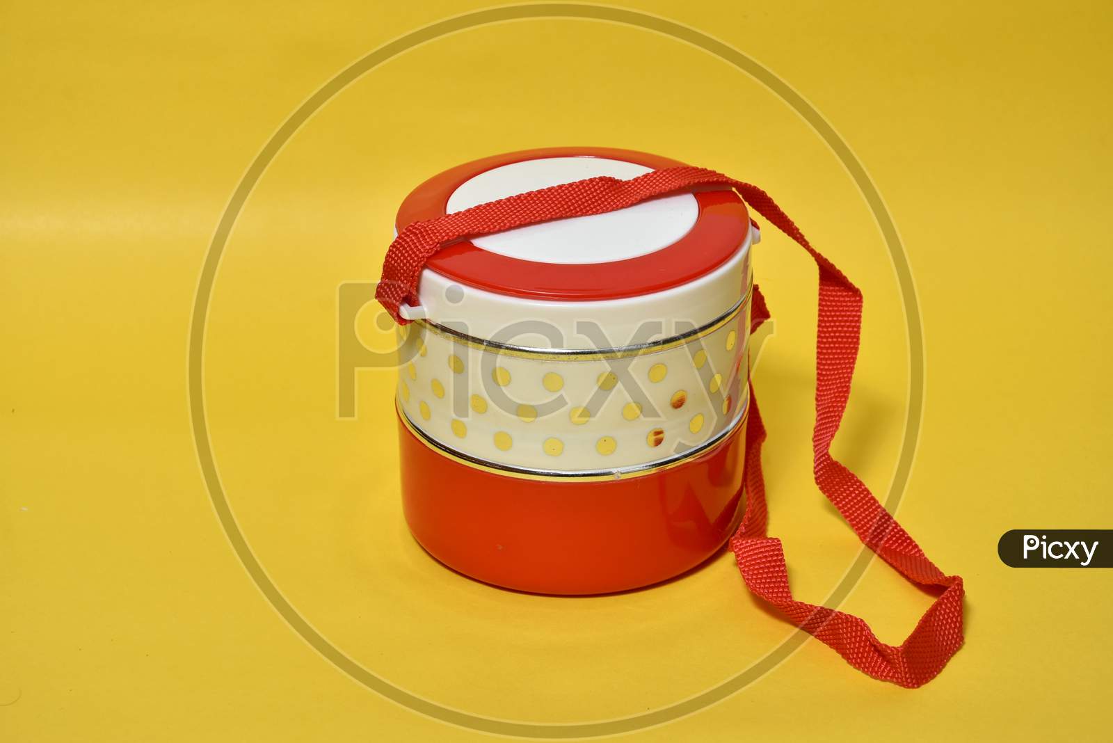 Tiffin isolated yellow background.