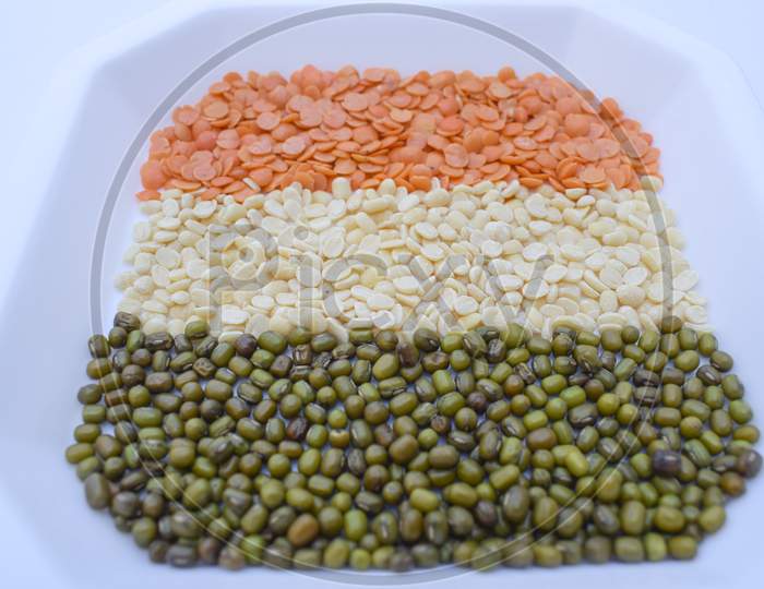 Happy Republic Day, Indian Republic Day Themed Tricolor Indian Flag Colors Saffron, White And Green. Indian Flag Themed Food, Indian Cuisine Dals, Pulses Lentils Arranged