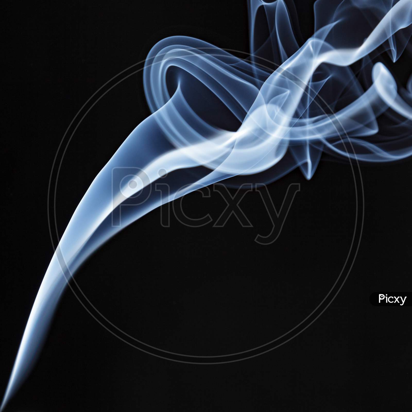 Incense Stick Smoke Trail Against A Black Background
