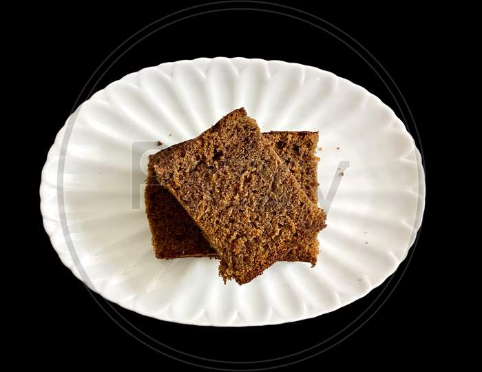 Plain Chocolate Cake Double Slice Being Served In A Plate