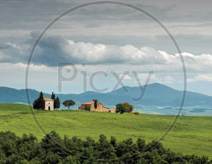 Small Church On The Crest Of A Hill In Val D'Orcia Near San Quiricio