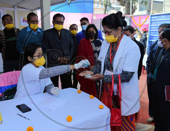 Nagaon : Health Workers  Sanitize Her Hand  Beforeb  Get Covid-19 Vaccination, After The Virtual Launch Of The Vaccine Drive By Prime Minister Narendra Modi, In At B.P Civil Hospital In Nagaon District Of Assam On Jan 16,2021.
