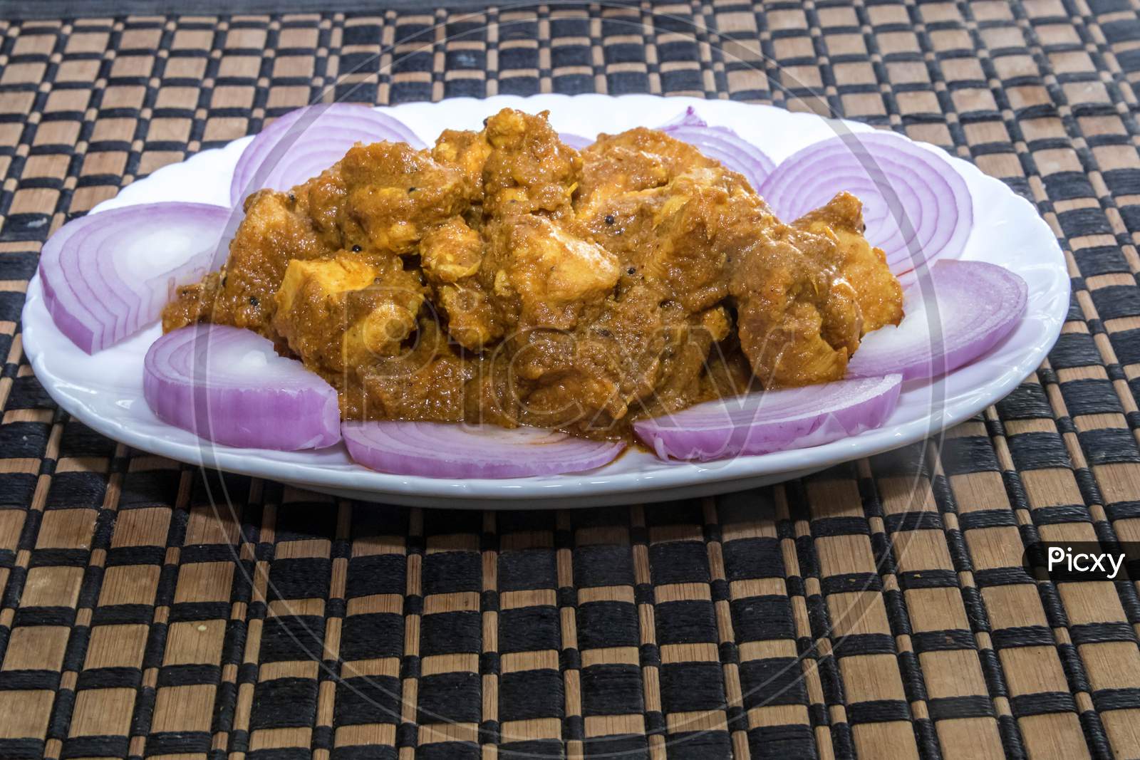Chicken Curry Andhra Style being served in a plate