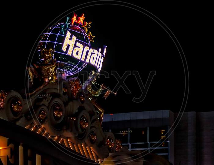Statues Outside The Harrah'S Hotel And Casino  In Las Vegas