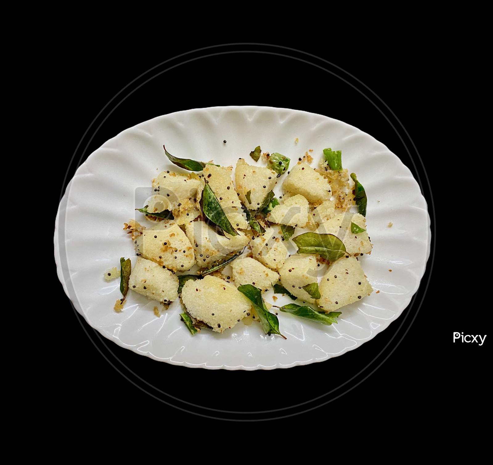 Delicious Seasoned Or Fry Idly Or Idli Served In A Plate