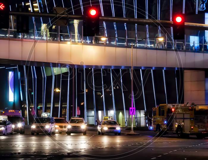 Traffic On The Strip Illuminated At Night In Las Vegas
