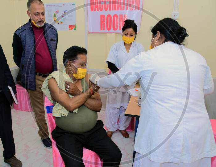 A Nurse administers the Covid-19 Vaccine to a frontline worker, after the virtual launch of Covid-19 Vaccination drive by Prime Minister Narendra Modi, at B.P bivil Hospital In Nagaon District Of Assam on Jan 16,2021.