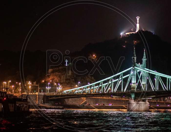 Liberty Bridge And Statue Illuminated At Night In Budapest