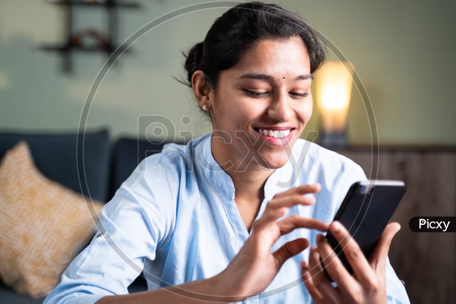 Happy Young Girl Smiling By Reading Funny Message Or Sms On Smartphone - Concept Of Using Social Media, Online Messaging App, Internet And Entertainment Lifestyle
