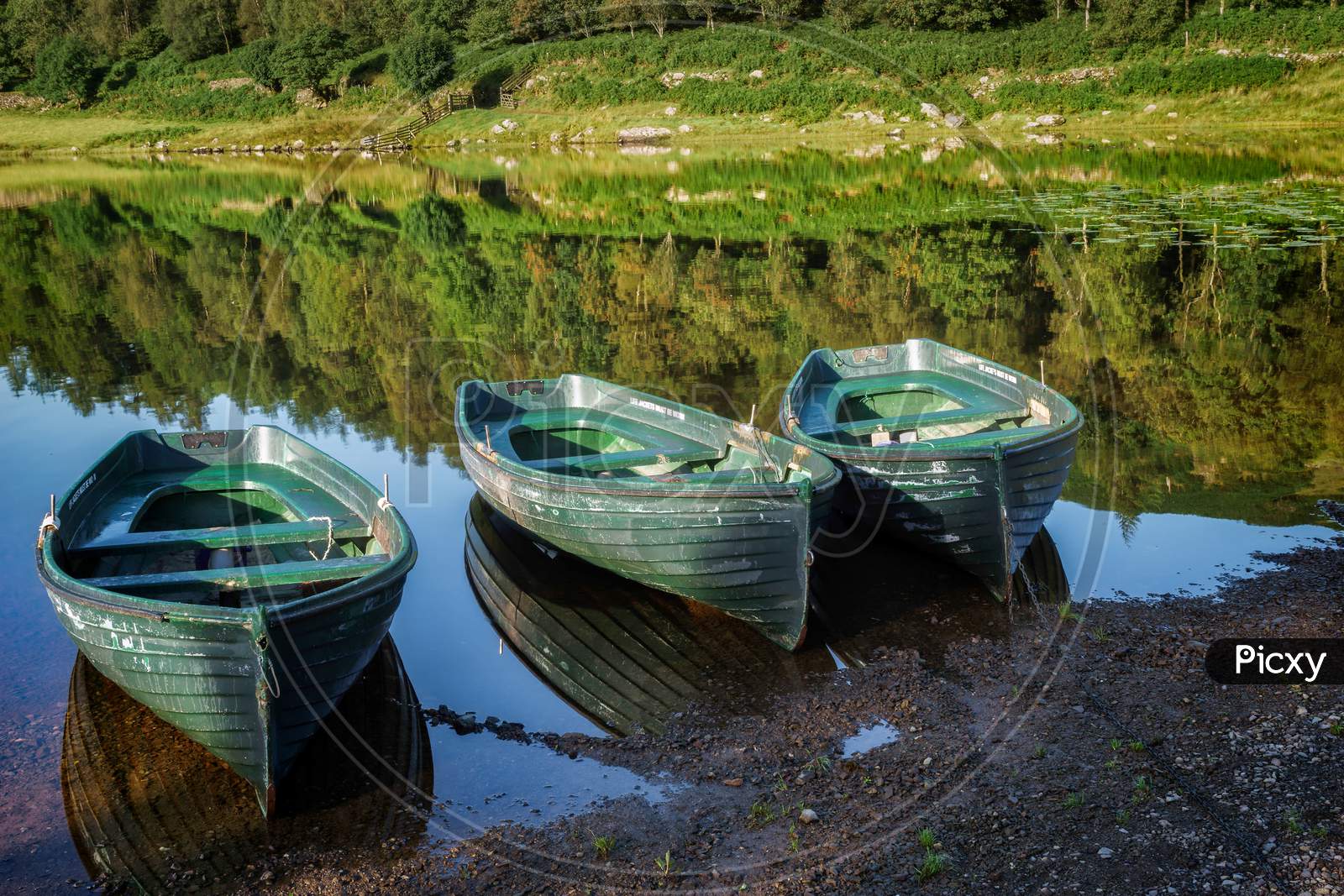 Rowing Boats Moored At Watendlath Tarn In The Lake District Cumbria