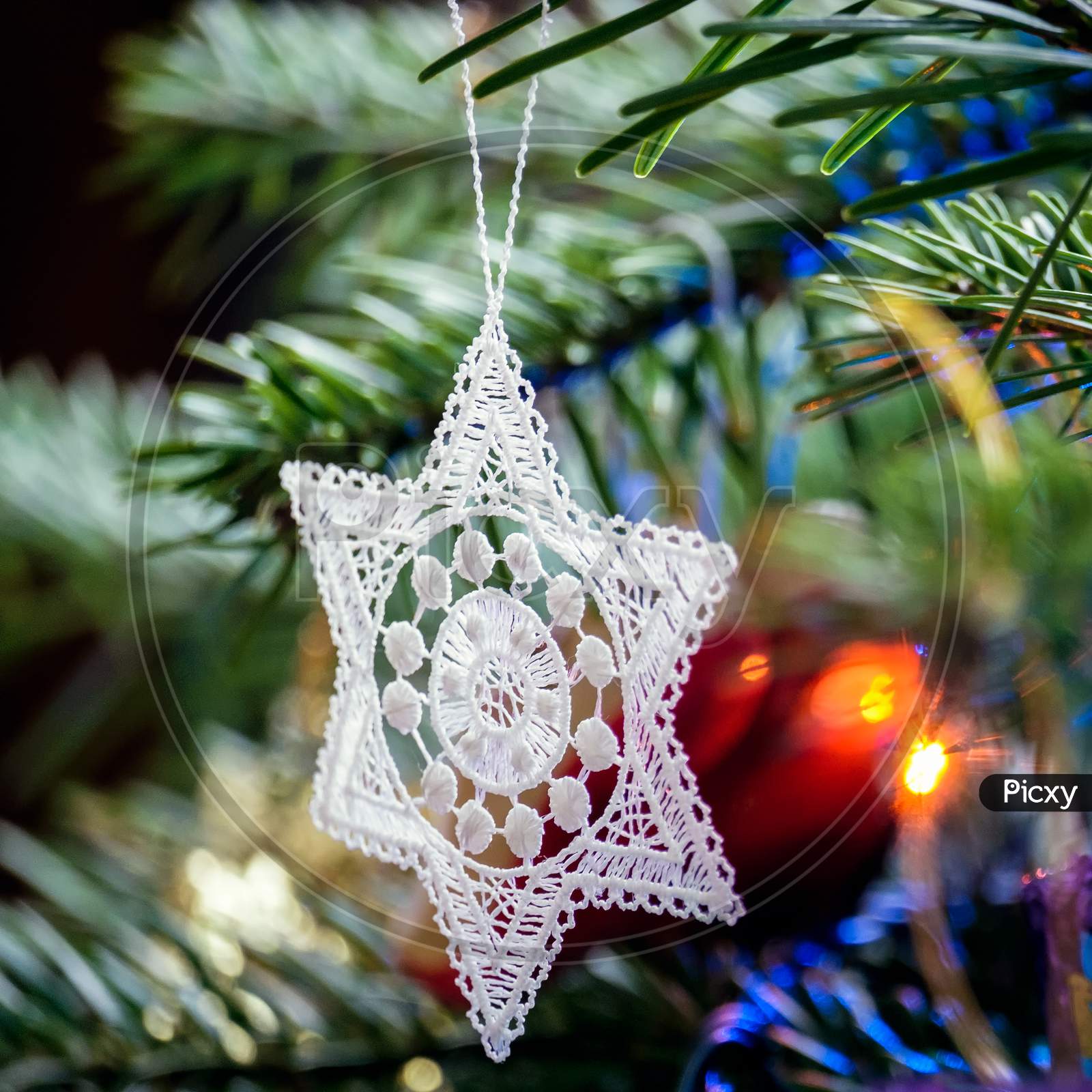 Crocheted Star On A Christmas Tree