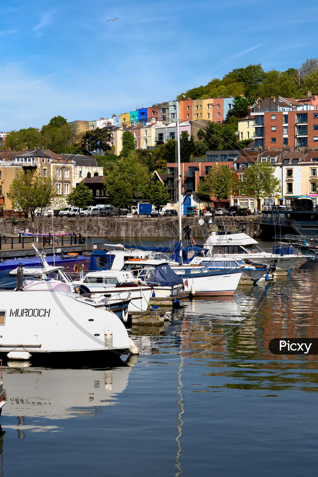 Bristol, Uk - May 14 : View Of Boats And Colourful Apartments Along The River Avon In Bristol On May 14, 2019. Three Unidentified People