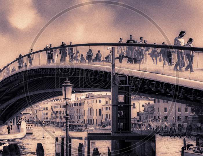 People Walking Over A New Bridge In Venice