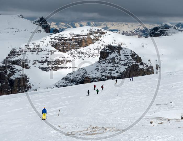 People Skiing From Sass Pordoi In The Upper Part Of Val Di Fassa