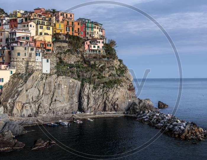 Manarola, Liguria/Italy  - April 21 : Coastal View At Dusk Of Manarola Liguria Italy On April 21, 2019. Unidentified People