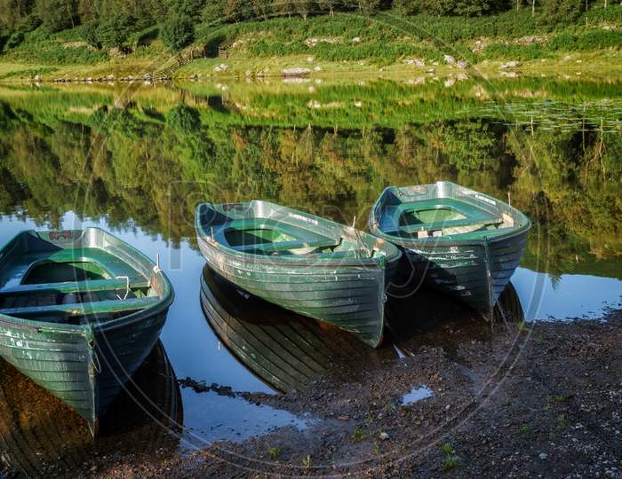 Rowing Boats Moored At Watendlath Tarn In The Lake District Cumbria