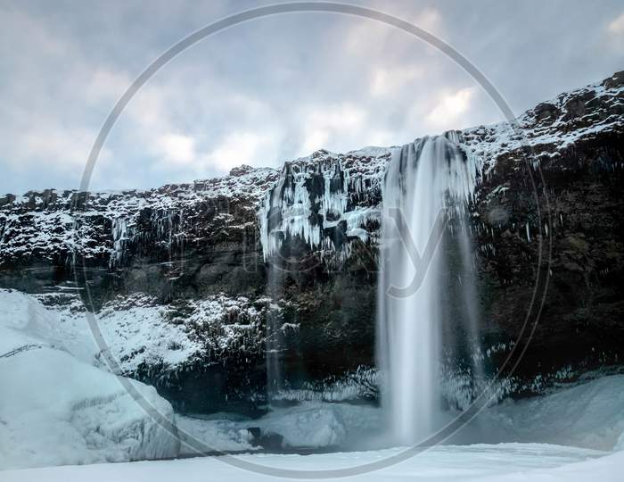 View Of Seljalandfoss Waterfall In Winter
